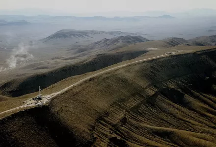 View to the south of Yucca Mountain crest showing coring activities.