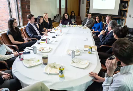 Photo of Robert Belfer, Nicholas Burns, Aditi Kumar and students discussion economic diplomacy.