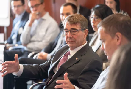 Ash Carter discusses science and technology challenges facing Congress with a group of Congressional staffers.