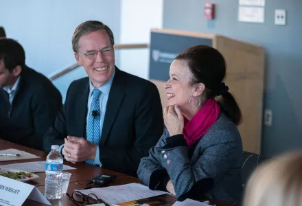 R. Nicholas Burns and Robin Wright laugh