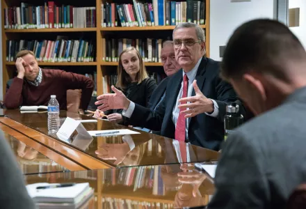 Ambassador Douglas Lute gestures