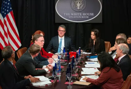 The participants discuss the crisis at the Situation Room table.
