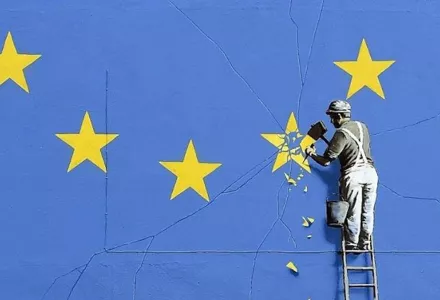 Man chipping at EU stars