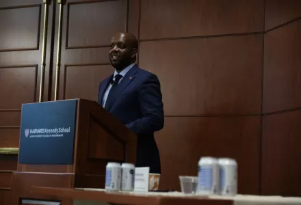 Ambassador Martin Kimani speaking at a podium