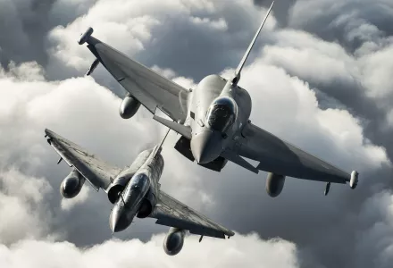 A Royal Air Force Typhoon of 1(F) Squadron (top) and a French Air Force Mirage 2000N practice their formation flying skills during Exercise Capable Eagle, October 2013.