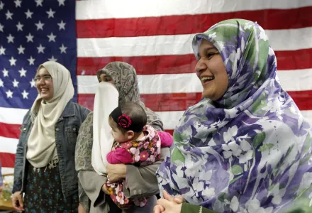 Photo of Pakistani immigrant family following naturalization. The father of the family was killed in a revenge killing post-9/11.