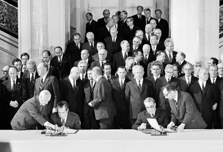 Signing of the SALT treaty between the U.S. and the U.S.S.R. is observed by officials as U.S. President Richard Nixon, left and Soviet leader Leonid Brezhnev, right, sign document in Moscow, May 26, 1972. (AP Photo)