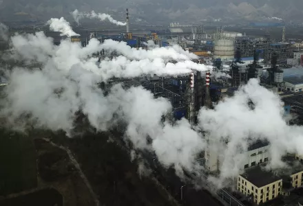 In this Nov. 28, 2019 file photo, smoke and steam rise from a coal processing plant in Hejin in central China's Shanxi Province.