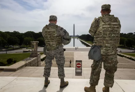 In this June 3, 2020 file photo members of the District of Columbia Army National Guard stand guard at the Lincoln Memorial in Washington securing the area as protests continue following the death of George Floyd, a who died after being restrained by Minneapolis police officers. An Ohio National Guardsman was removed from policing protests in Washington D.C. after the FBI found he expressed white supremacist ideology online, Gov. Mike DeWine announced in a briefing Friday, June 5, 2020. 