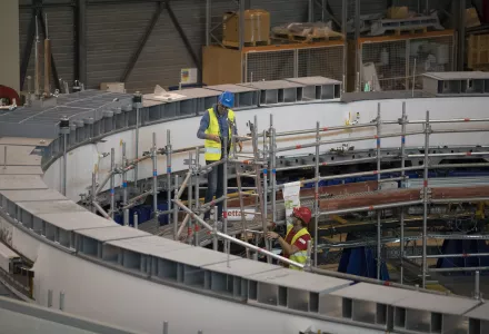 Technicians work on the poloidial field coil assembly line at the ITER (the International Thermonuclear Experimental Reactor) in Saint-Paul-Lez-Durance, southern France, Tuesday, July 28, 2020.