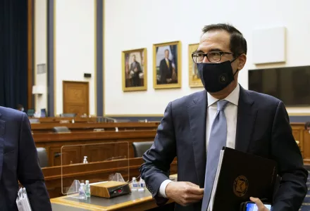 Federal Reserve Chair Jerome Powell, left, and Treasury Secretary Steve Mnuchin leave after a House Financial Services Committee hearing about the government’s emergency aid to the economy in response to the coronavirus on Capitol Hill in Washington on Tuesday, Sept. 22, 2020.