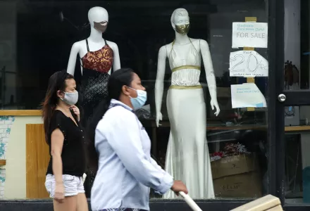 Women walk past mannequins wearing face masks advertised for sale, at a shop in Makati city, Philippines, Tuesday, Sept. 29, 2020.