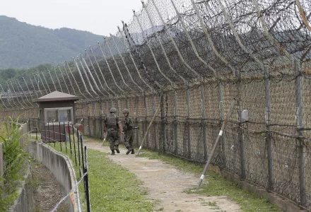 In this June 14, 2019, file photo, South Korean army soldiers patrol while hikers visit the DMZ Peace Trail in the demilitarized zone in Goseong, South Korea. 