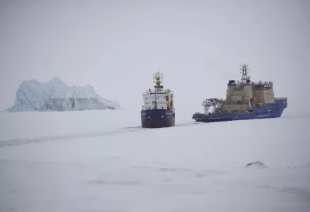 Russian icebreaker makes a path for a cargo ship