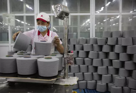 A worker wearing a mask a performing work