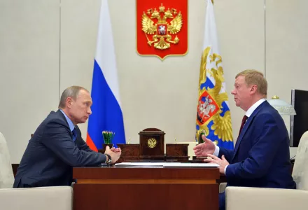 Russian President Vladimir Putin, left, listens to RUSNANO CEO Anatoly Chubais in the Novo-Ogaryovo residence, outside Moscow, Russia.