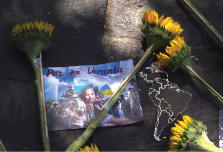 Sunflowers lay over an image with the Spanish message: "Peace in Ukraine" outside the Russian embassy after demonstrators protested Russia's invasion of Ukraine in Mexico City, March 24, 2022.