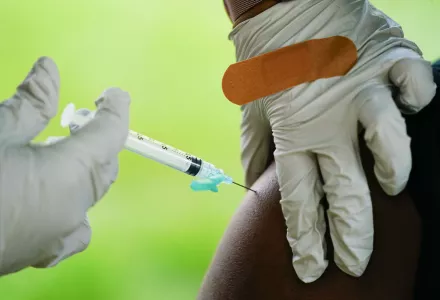 FILE - A health worker administers a dose of a Pfizer COVID-19 vaccine during a vaccination clinic in Reading, Pa., Sept. 14, 2021. 