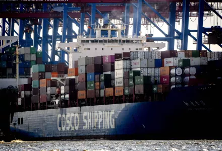 A container ship of Chinese Cosco shipping lies in the harbor in Hamburg, Germany, Wednesday, Oct. 26, 2022