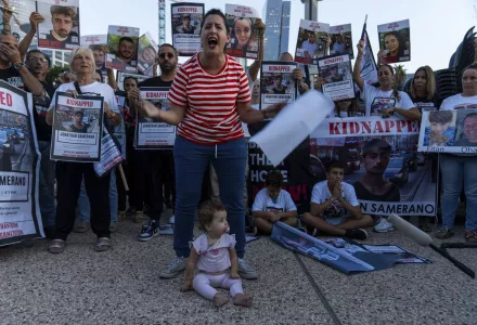 Relatives of people kidnapped by Hamas militants hold the pictures of their loved ones during a protest calling for their return, in Tel Aviv, Israel, Thursday, Oct. 26, 2023. On Oct. 7, more than 1,400 people were killed and over 220 captured in an unprecedented, multi-front attack by the militant group that rules Gaza.