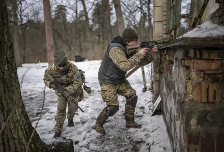 People practice combat skills in urban areas during a training course for national resistance of the Municipal Guard near Kyiv, Ukraine, on Jan. 19, 2024.