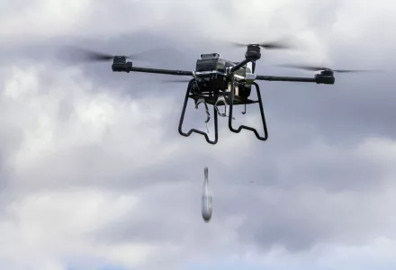 This photo released by the Russian Defense Ministry Press Service Saturday, April 20, 2024, shows an unmanned aerial vehicle drop a dummy bomb during its flight as Russian Defense Minister Sergei Shoigu visits the training ground of the Moscow Military District.