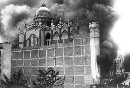 A Carmelite convent on fire in Madrid, Spain during riots.