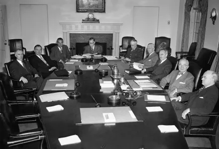 Photo of President Harry Truman meeting with members of the National Security Council and other advisers Jan. 24, 1952 for review of the defense situation.