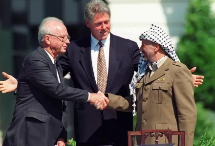 President Bill Clinton with with Israeli Prime Minister Yitzhak Rabin, left, and Palestinian leader Yasser Arafat, right, in Washington Sept. 13, 1993, marking the signing of the peace accord between Israel and the Palestinians. 