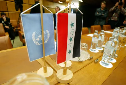  The U.N., left, and Iraqi flags sit on the table of the conference hall prior to the talks on details for a return of the U.N weapons inspectors to Iraq at the IAEA headquarters in Vienna, Austria, Monday, Sept. 30, 2002. 
