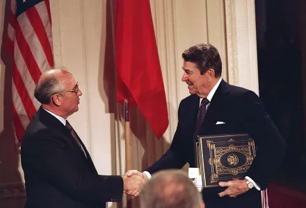Soviet leader Mikhail Gorbachev and U.S. President Ronald Reagan shake hands after signing the INF treaty