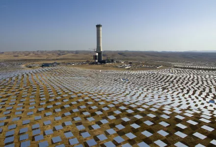 Mirrors (heliostats) circle a solar tower in the Negev desert, souther Israel
