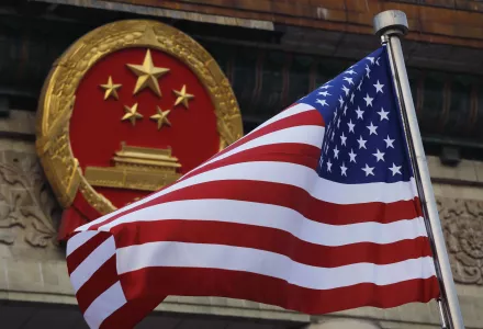 The American flag flies alongside a Chinese national symbol as President Donald Trump is welcomed to a summit in Beijing, November 9, 2017.