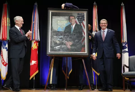 Defense Secretary James Mattis, left, applauds former Defense Secretary Ash Carter, right, during the portrait unveiling ceremony for the former secretary at the Pentagon on Friday, Feb. 2, 2018. (AP Photo/Jacquelyn Martin)