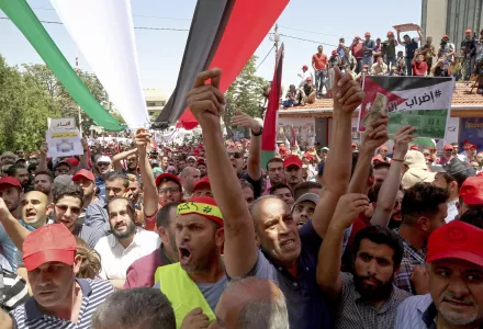 Jordanian protesters shout slogans during a demonstration outside the in front of the Labour Union office, in Amman, Jordan, Wednesday, June 6, 2018. (AP Photo/Raad al-Adayleh)