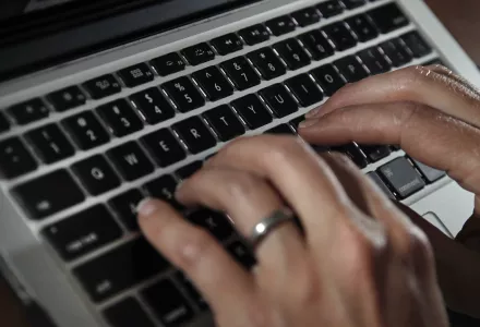 A person types on a laptop keyboard in North Andover, Mass, June 19, 2017. (AP Photo/Elise Amendola)