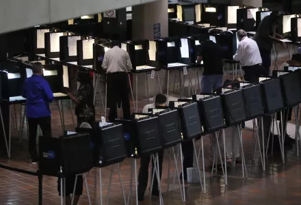 People vote on the first day of early voting in Miami-Dade County, Monday, Oct. 22, 2018.