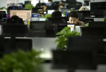A Watrix employee works at his desk in their company’s offices in Beijing, October 31, 2018. Watrix, a Chinese technology startup hopes to begin selling software that recognizes people by their body shape and how they walk, enabling identification when faces are hidden from cameras.