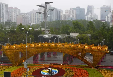 Workers dismantle the Belt and Road Forum logo next to the “Golden Bridge of Silk Road” structure outside the media center as leaders are attending the round table summit of the Belt and Road Forum chaired by Chinese President Xi Jinping in Beijing, Saturday, April 27, 2019