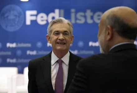 Federal Reserve Chairman Jerome Powell (L) speaks at a conference about the Fed's planned interest-rate strategy, June 4, 2019.