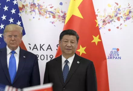 President Donald Trump, left, poses for a photo with Chinese President Xi Jinping.
