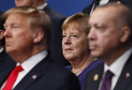 From left, French President Emmanuel Macron, U.S. President Donald Trump, German Chancellor Angela Merkel and Turkish President Recep Tayyip Erdogan pose during a group photo for a NATO leaders meeting at The Grove hotel and resort in Watford, Hertfordshire, England, Wednesday, Dec. 4, 2019.