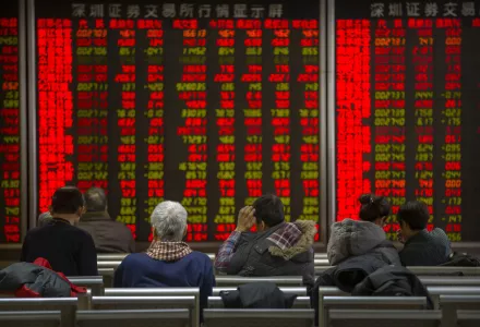 Chinese investors monitor stock prices at a brokerage house in Bejiing, Thursday, Dec. 26, 2019. Shares are mostly higher in Asia with many world markets closed for Christmas holidays.