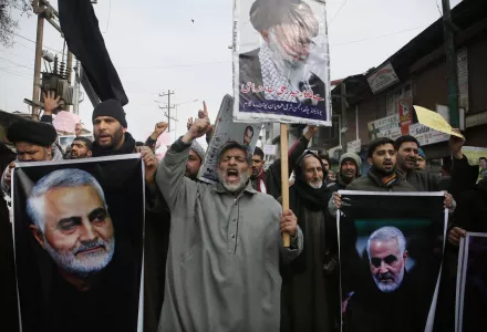 Kashmiri Shiite Muslims shout anti American and anti Israel slogans during a protest against U.S. airstrike in Iraq that killed Iranian Revolutionary Guard Gen. Qassem Soleimani, seen in the photographs, at Magam 37 kilometers (23 miles) north of Srinagar, Indian controlled Kashmir, Friday, Jan. 3, 2020