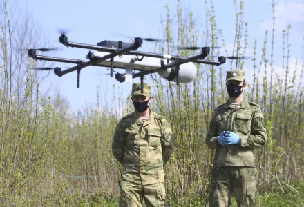 Russian National Guard soldiers operate a surveillance drone in Losiny Ostrov national park in northeastern Moscow, Sunday, May 3, 2020.