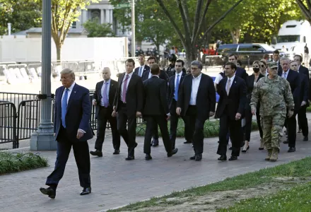 Photo of President Donald Trump, Secretary of Defense Mark Esper, and others walk in Lafayette Park for a photo outside St. John's Church across from the White House Monday, June 1, 2020, in Washington. 
