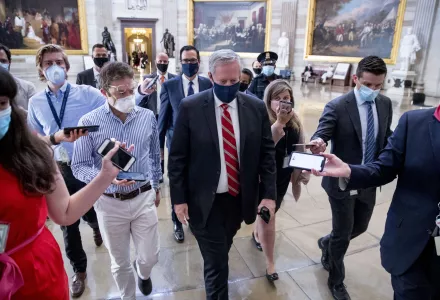 Treasury Secretary Steven Mnuchin, center left, and President Donald Trump's Chief of Staff Mark Meadows, center right, walk out of a meeting with House Speaker Nancy Pelosi of Calif., and Senate Minority Leader Sen. Chuck Schumer of N.Y., on Capitol Hill in Washington, Wednesday, July 29, 2020, after lawmakers were unable to reach a deal on a new coronavirus relief package.