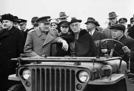 In this photo provided by the Department of Defense, President Franklin D. Roosevelt sits in a jeep at Yalta with British Prime Minister Winston Churchill and V.M. Molotov, Feb. 1945.