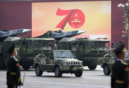 Chinese military vehicles in parade.
