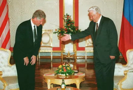 Boris Yeltsin invites U.S. President Bill Clinton to take a seat